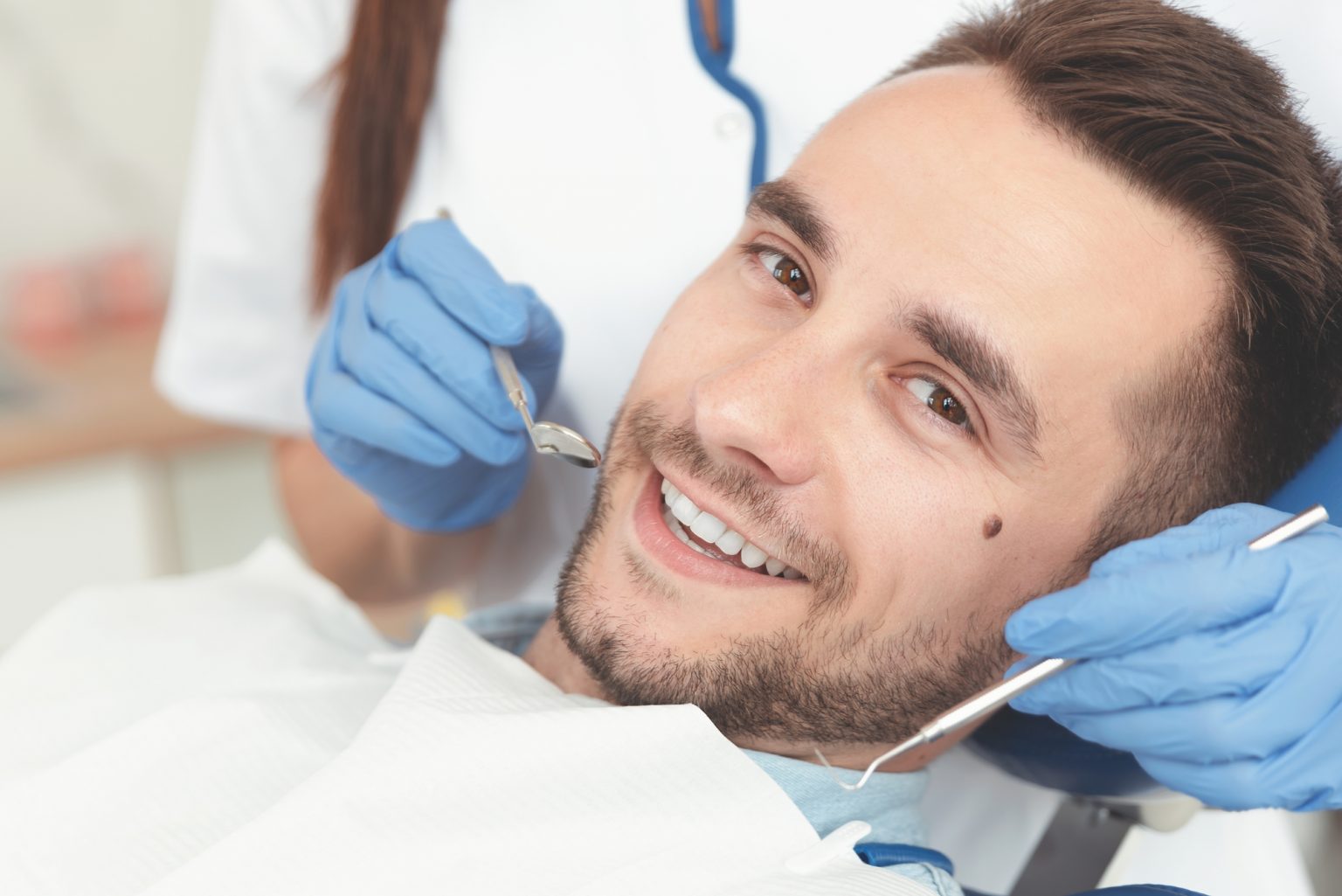 Young man at the dentist. Dental care, treatment of teeth, taking care of teeth