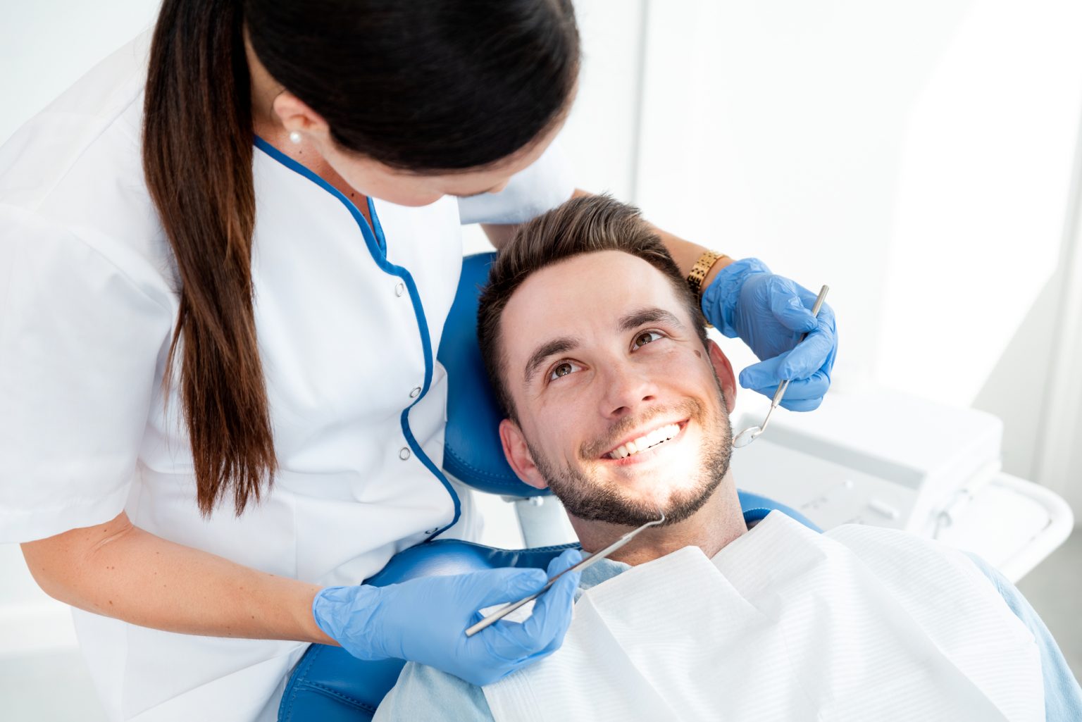 Man having teeth examined at dentists. Overview of dental caries prevention